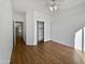 Spacious bedroom with wood floors and built-in shelving at 6546 E Casa De Risco Ln, Gold Canyon, AZ 85118