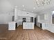 Modern kitchen with island, stainless steel appliances, and white cabinets at 6546 E Casa De Risco Ln, Gold Canyon, AZ 85118