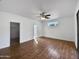 Bright main bedroom with hardwood floors and a large window at 6546 E Casa De Risco Ln, Gold Canyon, AZ 85118
