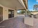 Covered patio with pavers, ceiling fan, and built-in bar at 6546 E Casa De Risco Ln, Gold Canyon, AZ 85118