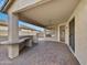 Covered patio with pavers and access to the backyard at 6546 E Casa De Risco Ln, Gold Canyon, AZ 85118