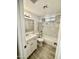 Clean bathroom includes a vanity, toilet, and tiled shower/tub with modern fixtures at 8323 W Devonshire Ave, Phoenix, AZ 85037