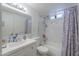 Clean bathroom, bathtub, shower and updated vanity at 8323 W Devonshire Ave, Phoenix, AZ 85037