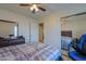 Spacious bedroom with mirrored closet and ensuite bathroom access at 8323 W Devonshire Ave, Phoenix, AZ 85037