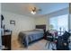 Bedroom with double bed, nightstand, and wood floors at 8323 W Devonshire Ave, Phoenix, AZ 85037