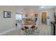 Cozy dining area with white table and chairs, located near the kitchen at 8323 W Devonshire Ave, Phoenix, AZ 85037