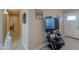 Entryway with TV stand, Gathering photos and hardwood floors at 8323 W Devonshire Ave, Phoenix, AZ 85037