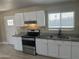 Modern kitchen showcasing granite counters, stainless steel appliances and a window at 8323 W Devonshire Ave, Phoenix, AZ 85037