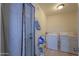 Functional laundry room, washer, dryer, and storage at 8323 W Devonshire Ave, Phoenix, AZ 85037