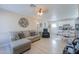 Bright living room featuring a comfortable sectional sofa and easy access to the kitchen at 8323 W Devonshire Ave, Phoenix, AZ 85037