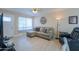 Bright living room with sectional sofa, recliner, and plenty of natural light at 8323 W Devonshire Ave, Phoenix, AZ 85037