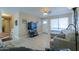 Open concept living room with a flat screen TV and comfortable seating at 8323 W Devonshire Ave, Phoenix, AZ 85037