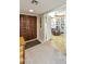 Bright entryway with wood doors and view into library at 10008 E Michigan Ave, Sun Lakes, AZ 85248