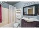 Clean bathroom with shower/tub, vanity, and storage at 10534 W Reade Ave, Glendale, AZ 85307