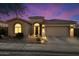 Beautiful desert home with landscaped front yard and two-car garage at dusk at 10625 E Blanche Dr, Scottsdale, AZ 85255