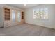 Bedroom with mirrored wardrobe and window shutters at 10833 E Flintlock Dr, Sun Lakes, AZ 85248