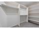 Large walk-in closet with ample shelving and hanging space at 10833 E Flintlock Dr, Sun Lakes, AZ 85248