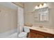 Classic bathroom with bathtub and wood vanity at 11034 W Alabama Ave, Sun City, AZ 85351