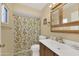 Clean bathroom with shower/tub and wood vanity at 11034 W Alabama Ave, Sun City, AZ 85351