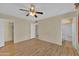 Bright bedroom with hardwood floors and an ensuite bathroom at 11034 W Alabama Ave, Sun City, AZ 85351