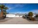 Single story home with a two-car garage and nicely landscaped front yard at 11034 W Alabama Ave, Sun City, AZ 85351