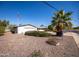 Ranch style home with a two-car garage and mature landscaping at 11034 W Alabama Ave, Sun City, AZ 85351