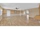 Spacious living room featuring hardwood floors and a ceiling fan at 11034 W Alabama Ave, Sun City, AZ 85351