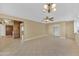 Large living area with tile floors and access to backyard at 11034 W Alabama Ave, Sun City, AZ 85351