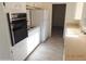 Kitchen with white cabinets and appliances at 1133 E 11Th St, Casa Grande, AZ 85122