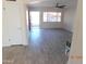 Living room with light grey wood-look flooring at 1133 E 11Th St, Casa Grande, AZ 85122