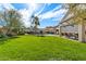 Expansive grassy backyard with pool and patio at 1231 N Crystal Shores Dr, Gilbert, AZ 85234