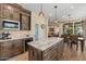 Kitchen with granite island, stainless steel appliances, and hardwood floors at 1231 N Crystal Shores Dr, Gilbert, AZ 85234