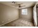 Well-lit bedroom with ceiling fan and window at 14819 N Mauna Loa Ln, Phoenix, AZ 85053