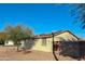 House exterior showcasing a well-maintained single story home with a spacious yard and solar panels at 14819 N Mauna Loa Ln, Phoenix, AZ 85053