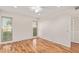 Bright bedroom with laminate wood floor and ceiling fan at 15446 N Lakeforest Dr, Sun City, AZ 85351