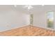 Spacious bedroom with laminate flooring and large windows at 15446 N Lakeforest Dr, Sun City, AZ 85351