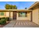 Front entrance with decorative columns and a paved walkway at 15446 N Lakeforest Dr, Sun City, AZ 85351