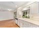 Kitchen features white cabinets and a window view at 15446 N Lakeforest Dr, Sun City, AZ 85351