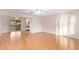 Living room featuring laminate wood floors and a sliding glass door at 15446 N Lakeforest Dr, Sun City, AZ 85351