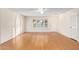 Living room with laminate flooring and window with blinds at 15446 N Lakeforest Dr, Sun City, AZ 85351