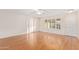 Living room with wood-look flooring and a view of the backyard at 15446 N Lakeforest Dr, Sun City, AZ 85351