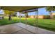 Covered patio overlooking a grassy backyard at 15446 N Lakeforest Dr, Sun City, AZ 85351