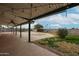 Covered patio with ceiling fan overlooking the backyard at 19230 N 13Th St, Phoenix, AZ 85024