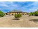 Large backyard with mature trees and desert landscaping at 20811 E Excelsior Ave, Queen Creek, AZ 85142