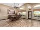 Bright dining room with large windows and wooden table at 20811 E Excelsior Ave, Queen Creek, AZ 85142