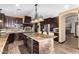 Spacious kitchen with granite countertops and dark wood cabinets at 20811 E Excelsior Ave, Queen Creek, AZ 85142