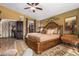 Luxurious main bedroom with a king-size bed and ensuite bathroom access at 20811 E Excelsior Ave, Queen Creek, AZ 85142