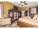 Spacious main bedroom with king bed and access to ensuite bathroom at 20811 E Excelsior Ave, Queen Creek, AZ 85142