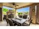 Covered patio with seating area, fire pit, and mountain views at 20811 E Excelsior Ave, Queen Creek, AZ 85142