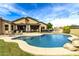 Relaxing kidney-shaped pool and spa with patio seating at 20811 E Excelsior Ave, Queen Creek, AZ 85142